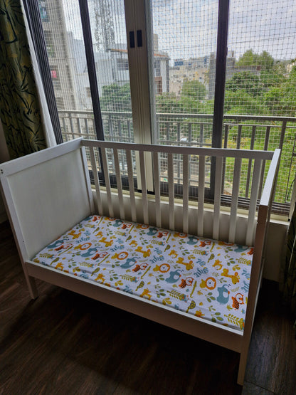 IKEA Height adjustable Baby Crib with mattress, mattress protector and fitted bedsheet