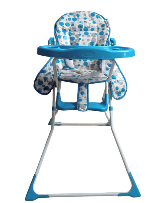 Blue and patterned high chair on a tiled floor with a tiled wall background