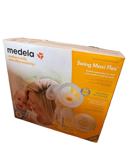 Medela Swing Maxi Flex packaging on a wooden surface