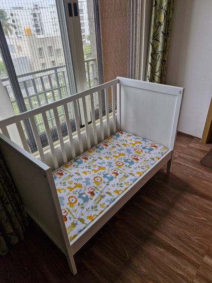 IKEA Height adjustable Baby Crib with mattress, mattress protector and fitted bedsheet
